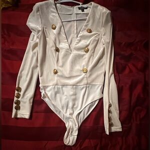 New never worn champagne color Bodysuit. Size medium.